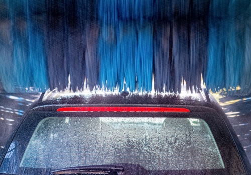 A vehicle going through a car wash with a Water Reclaim System in Racine WI