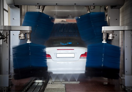 A car being washed in a car wash using a water recycling system