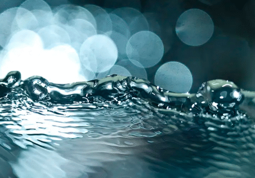 Previously dirty water from a car wash, having been treated in a water reclaim system